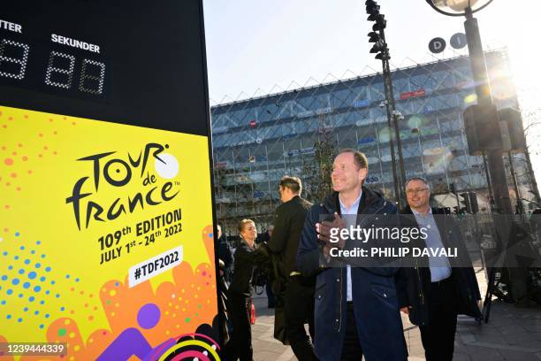 Tour de France race director Christian Prudhomme claps his hands after the official countdown clock of the Tour de France was turned on at the City...