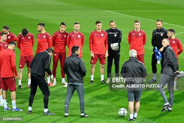 North Macedonia 's goalkeeper Damjan Siskovski , teammates and staff gather during a training session on the eve of the 2022 World Cup qualifying...