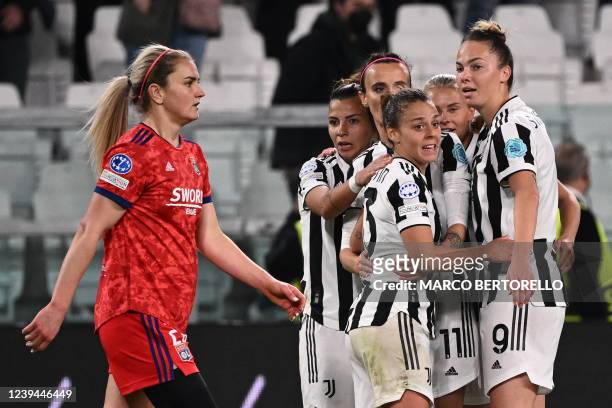 Juventus' Czech forward Andrea Staskova, Juventus' Italian forward Barbara Bonansea, and Juventus' Italian defender Lisa Boattin clebrate as Lyon's...
