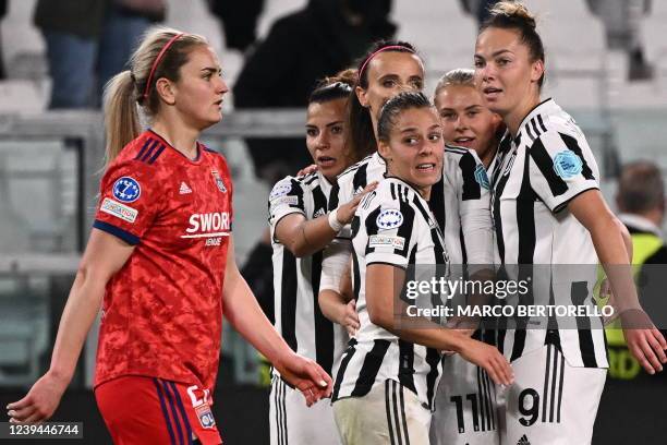 Juventus' Czech forward Andrea Staskova, Juventus' Italian forward Barbara Bonansea, and Juventus' Italian defender Lisa Boattin clebrate as Lyon's...