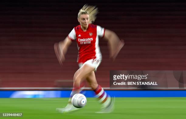Arsenal's English defender Leah Williamson runs with the ball during the UEFA Women's Champions League quarter-final football match between Arsenal...