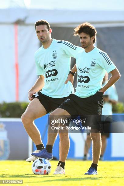 Lionel Scaloni head coach of Argentina and Pablo Aimar assistant coach of Argentina react during a training session at Julio H. Grondona Training...