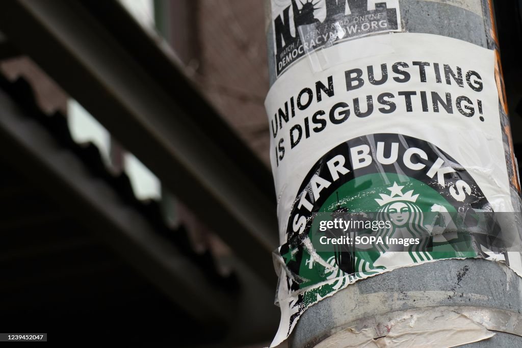 A pro-union poster is seen on a lamp pole outside Starbucks...