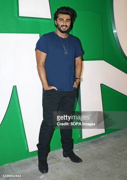 Bollywood actor Arjun Kapoor poses for a photo during 'VegNonVeg' store opening party in Mumbai. 'VegNonVeg' is a multi-brand sneaker store opened by...