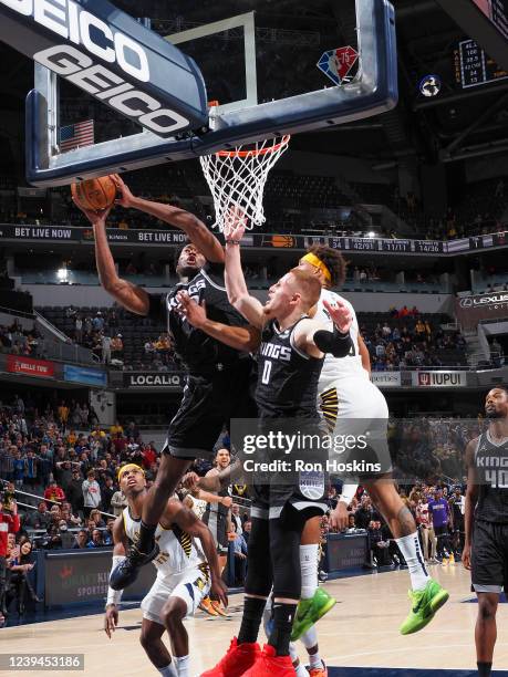 Damian Jones of the Sacramento Kings rebounds the ball and scores the go-ahead basket during the game against the Indiana Pacers on March 23, 2022 at...