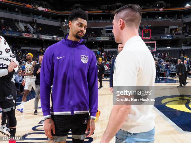 Jeremy Lamb of the Sacramento Kings talks to T.J. McConnell of the Indiana Pacers after the game on March 23, 2022 at Gainbridge Fieldhouse in...