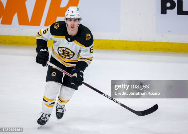 Mike Reilly of the Boston Bruins keeps an eye on the play during third period action against the Winnipeg Jets at Canada Life Centre on March 18,...