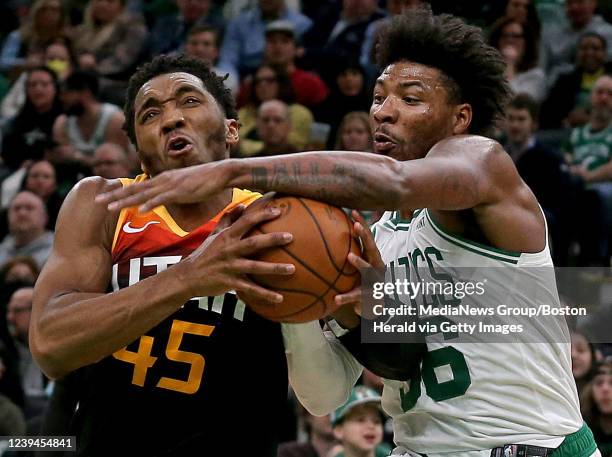 March 23: Marcus Smart of the Boston Celtics blocks Donovan Mitchell of the Utah Jazz during the second half of the NBA game at the TD Garden on...