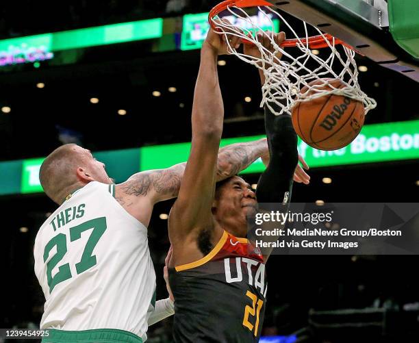 March 23: Daniel Theis of the Boston Celtics tries to stop Hassan Whiteside of the Utah Jazz during the second half of the NBA game at the TD Garden...