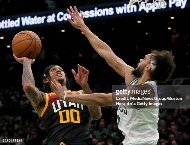 March 23: Derrick White of the Boston Celtics tries to stop Jordan Clarkson of the Utah Jazz during the second half of the NBA game at the TD Garden...