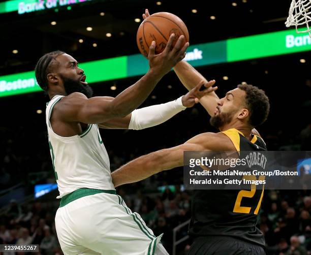 March 23: Jaylen Brown of the Boston Celtics goes up against Rudy Gobert of the Utah Jazz during the first half of the NBA game at the TD Garden on...