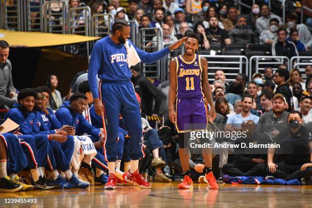 DeAndre Jordan of the Philadelphia 76ers talks to Malik Monk of the Los Angeles Lakers during the game on March 23, 2022 at Crypto.Com Arena in Los...