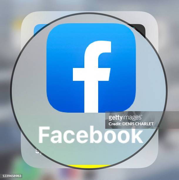 This photograph taken on March 23 shows the logo of US social media platform Facebook displayed on a tablet in Lille, northern France.