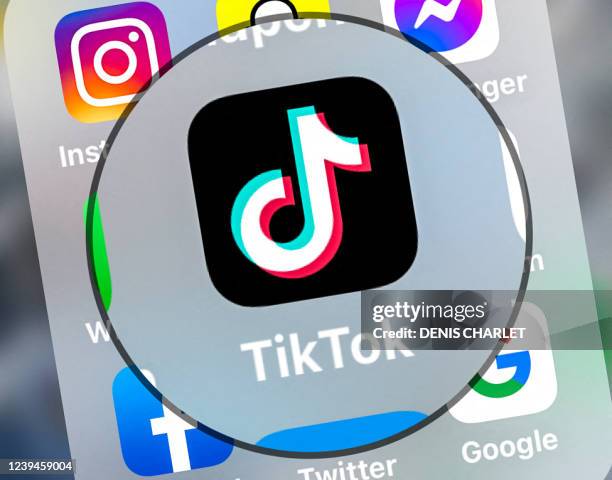 This photograph taken on March 23 shows logo of the networking application TikToK displayed on a tablet in Lille, northern France.