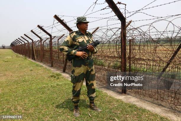 Indian Border Security Force soldier patrolling at the near Petrapole Border outpost at the India-Bangladesh Border on the outskirts of Kolkata,India...