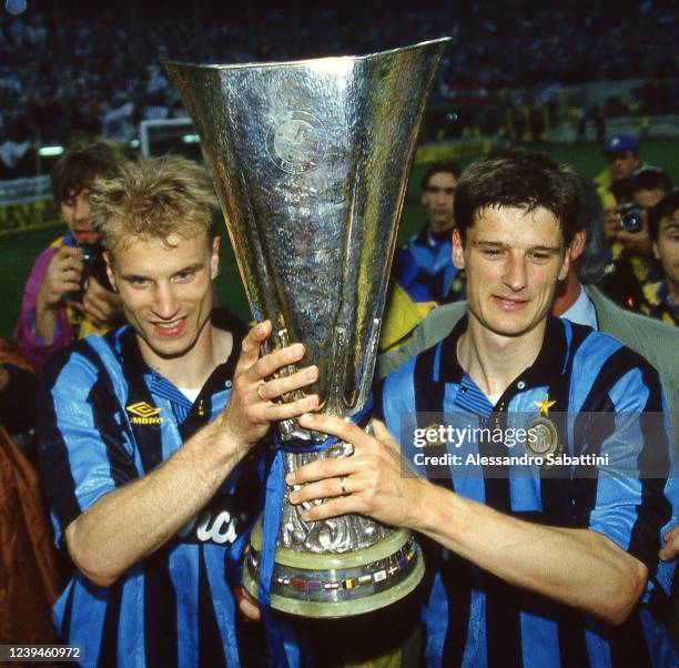 Dennis Bergkamp and Wilhelm Jonk of FC Interanzionale celebrate the victory with the trophy after the Final UEFA Cup 1994 match between Austria...