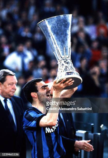Giuseppe Bergomi of FC Internzaionale celebrates the victory with the trophy after the Final UEFA Cup 1991 match between AS Roma and FC...