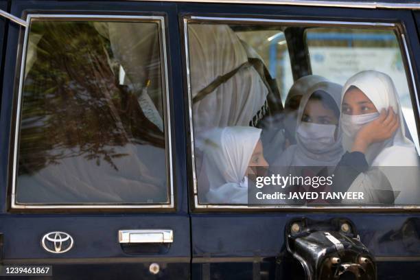 School girls travel on a vehicle in Kandahar on March 24, 2022. - The Taliban ordered girls' secondary schools in Afghanistan to shut on March 23...