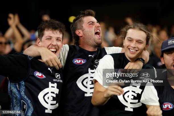 Carlton fans celebrate during the 2022 AFL Round 02 match between the Western Bulldogs and the Carlton Blues at Marvel Stadium on March 24, 2022 In...