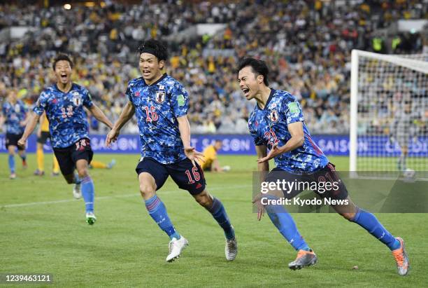 Japan's Kaoru Mitoma reacts after opening the scoring late in the second half of a Group B football match against Australia in Sydney on March 24 in...