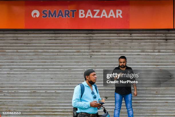 People are seen in front of undergoing renovation Reliance Smart bazar store , which was formerly Future retail Big Bazar Store , in Kolkata , India...