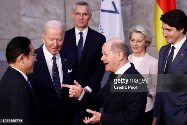 Japan's Prime Minister Fumio Kishida, U.S. President Joe Biden and Germany's Chancellor Olaf Scholz speak next to NATO Secretary General Jens...