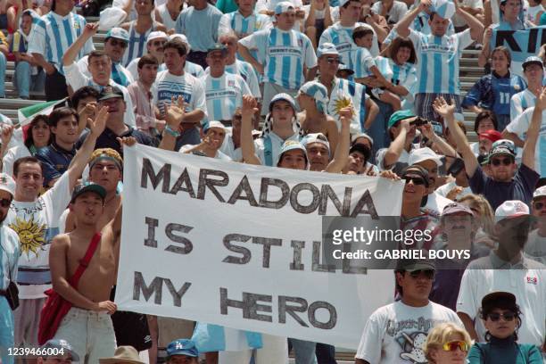 Argentine fans display a banner reading "Maradona is Still My Hero" at Pasadena's Rose Bowl on July 3 referring to the doping test failed by the...