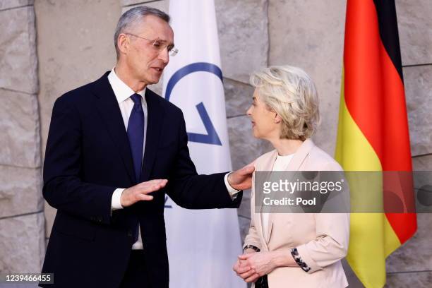 Secretary General Jens Stoltenberg speaks with European Commission President Ursula von der Leyen before a G7 leaders' family photo during a NATO...