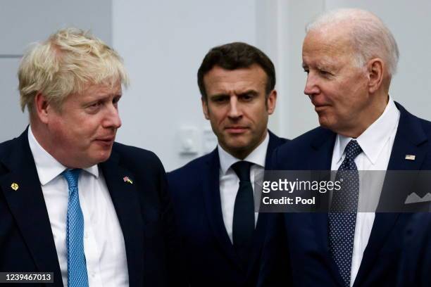 British Prime Minister Boris Johnson, France's President Emmanuel Macron and U.S. President Joe Biden arrive for a G7 leaders' family photo during a...