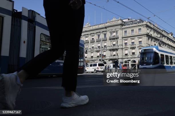 Passenger trams travel by the Credit Suisse Group AG headquarters in Zurich, Switzerland, on Thursday, March 24, 2022. Credit Suisse warned it may...