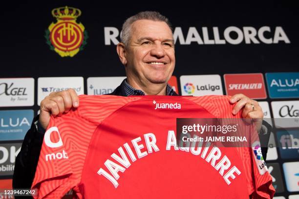 Mexican coach Javier Aguirre smiles as he poses with his jersey, during his official presentation as new coach of Mallorca football club, at the...