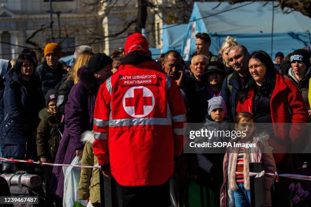 Member of the red cross helps organize refugees from Mariupol. A train carrying refugees from war torn Mariupol arrived at the Lviv train station....