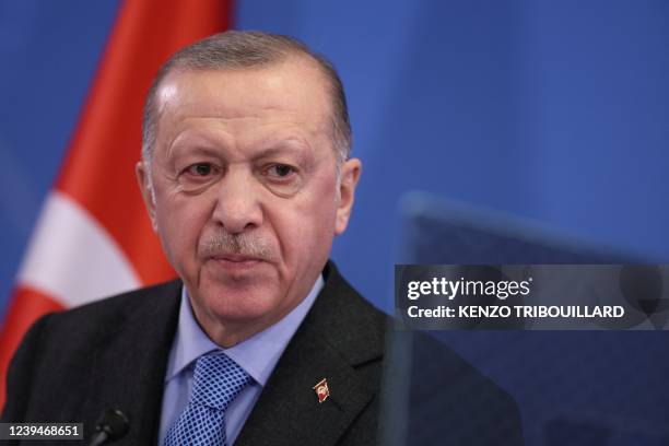 Turkey's President Recep Tayyip Erdogan addresses media representatives during a press conference at an European Union summit at EU Headquarters in...