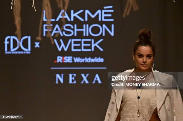 Bollywood actress Kangana Ranaut presents a creation by Khadi India during a fashion show at the FDCI x Lakme Fashion Week in New Delhi on March 24,...