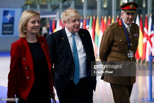 British Prime Minister Boris Johnson, Foreign Secretary Liz Truss and military representative to NATO Ben Bathurst leave NATO Headquarters following...