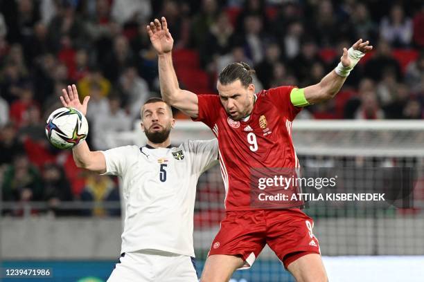 Serbia's defender Matija Nastasic and Hungary's forward Adam Szalai vie for the ball during the UEFA friendly football match Hungary vs Serbia in...