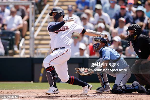 Minnesota Twins catcher Gary Sanchez bats during a spring training baseball game against the Tampa Bay Rays on March 24, 2022 at Hammond Stadium in...