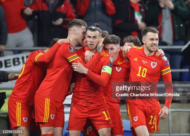 Joe Rodon of Wales celebrates with the scorer of the opening Welsh goal, Gareth Bale during the 2022 FIFA World Cup Qualifier knockout round play-off...