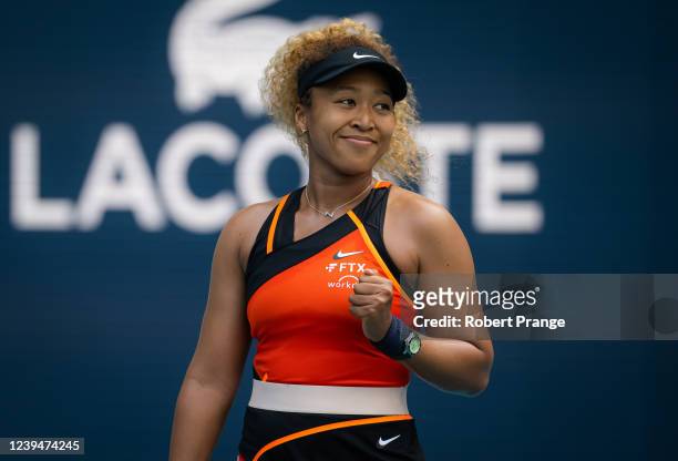 Naomi Osaka of Japan celebrates winning a point against Angelique Kerber of Germany in her second round match on day 4 of the Miami Open at Hard Rock...