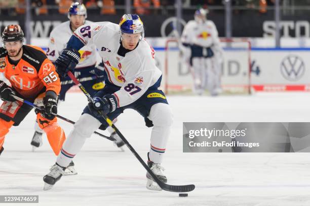 Philip Gogulla of EHC Red Bull Muenchen controls the Puck during the Penny DEL match between Grizzlys Wolfsburg and EHC Red Bull München at Eis Arena...