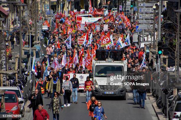 Crowd of protesters march on the street during the demonstration. Retirees have held protests in some 20 towns across France to demand higher...