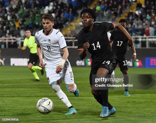 Sebastiano Esposito of Italy U20 and Christalino Atemona of Germany U20 in action during the international friendly match between Italy U20 and...