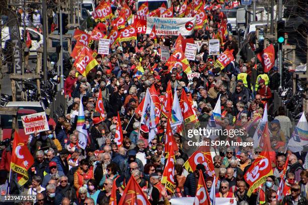 Crowd of protesters march on the street during the demonstration. Retirees have held protests in some 20 towns across France to demand higher...