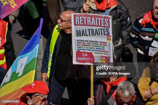 Protester holds a placard expressing his opinion during the demonstration. Retirees have held protests in some 20 towns across France to demand...
