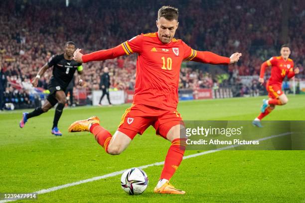 Aaron Ramsey of Wales crosses the ball into the box during the 2022 FIFA World Cup Qualifier knockout round play-off match between Wales and Austria...