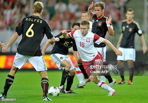Poland's midfielder Jakub Blaszczykowski vies for the ball with Germany's defender Christian Traesch during the International friendly football match...