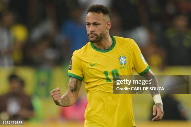 Brazil's Neymar celebrates after scoring against Chile during their South American qualification football match for the FIFA World Cup Qatar 2022, at...