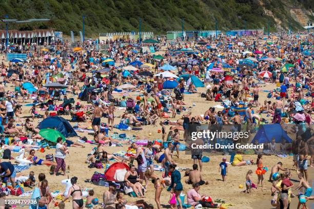 Massive crowds gather on Bournemouth beach making Social distancing very difficult on May 31, 2020 in Bournemouth, England. The British government...