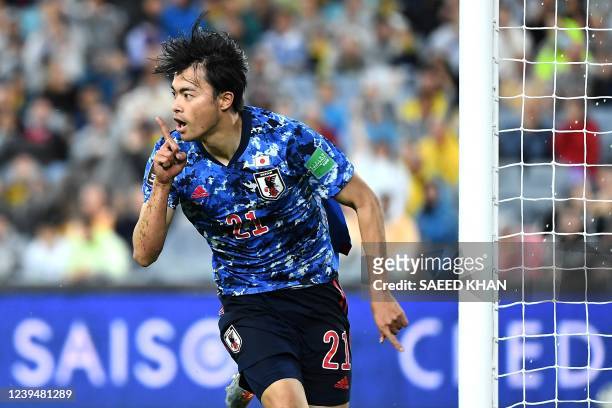 This picture taken on March 24, 2022 shows Japan's Kaoru Mitoma celebrating after scoring during the Qatar World Cup 2022 Asian zone Group B...