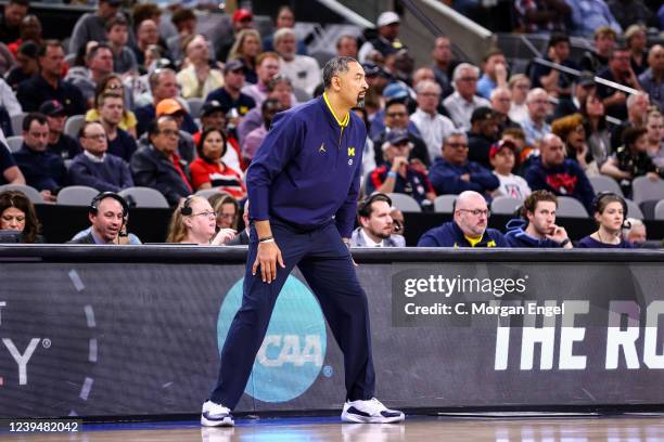 Head coach Juwan Howard of the Michigan Wolverines watches the game during the Sweet 16 round of the 2022 NCAA Mens Basketball Tournament held at...